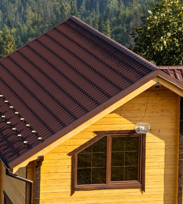 Yellow home with brown roof