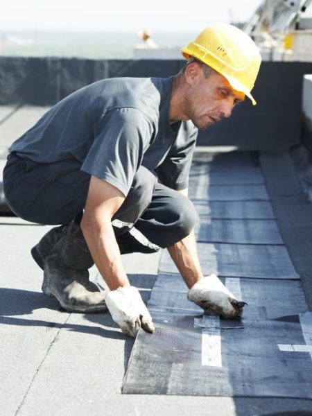 Roofer performing maintenance task