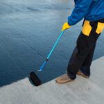 expert waterproofing the roof of a commercial building