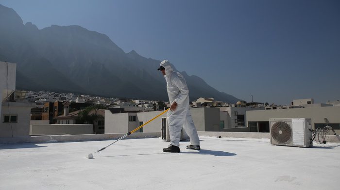 commercial waterproofing contractor working on roof waterproofing