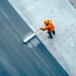 Construction Worker Applying Waterproofing